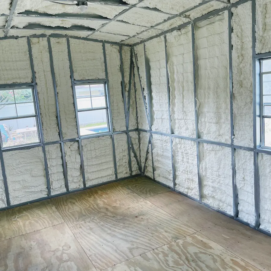 Closed-cell spray foam insulation applied to wall cavities in a residential project in Derry
